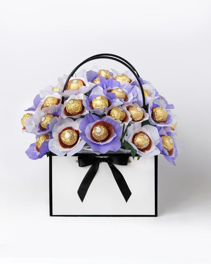 Custom gift bouquet featuring whimsical purple blooms with chocolate centres