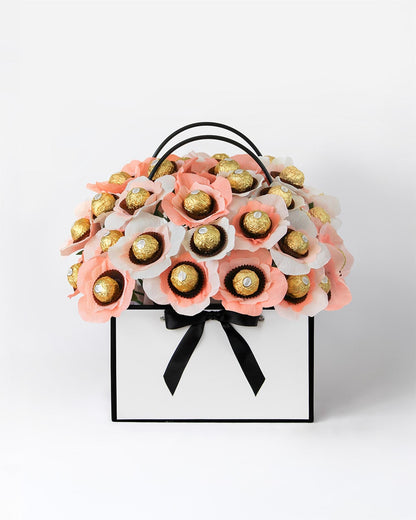 Gift bouquet featuring pastel peach and ivory handmade chocolate blooms