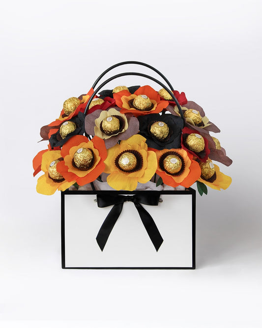 Handmade chocolate bouquet in warm autumn hues of pumpkin, spice and halloween.
