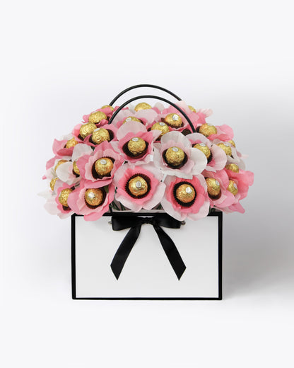 Custom gift bouquet with fresh lemonade and raspberry pink flowers and chocolate centres