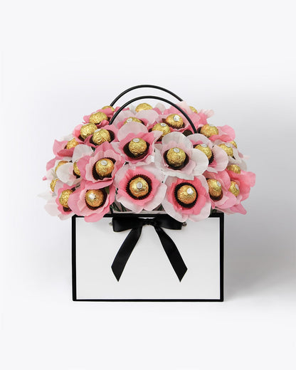 Raspberry Lemonade bloom box with handmade raspberry pink and lemonade coloured chocolate-centred flowers