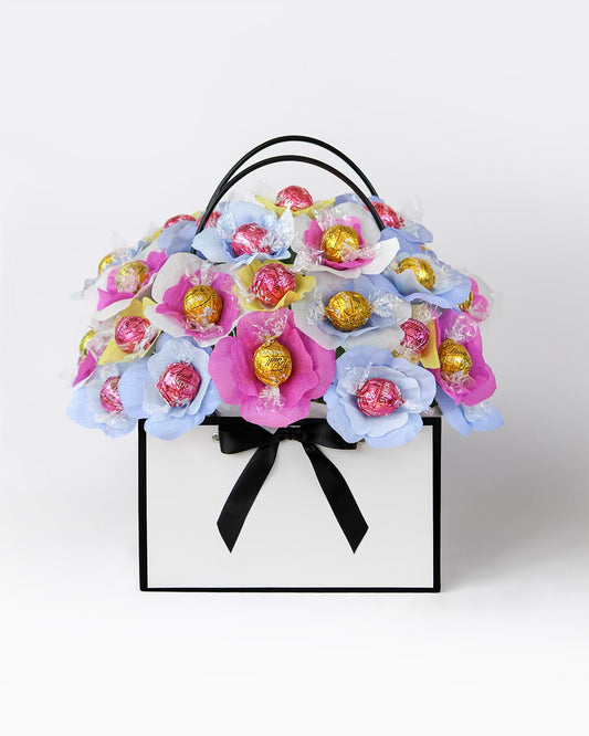 Handmade bouquet in birthday rainbow tones with edible chocolate centres