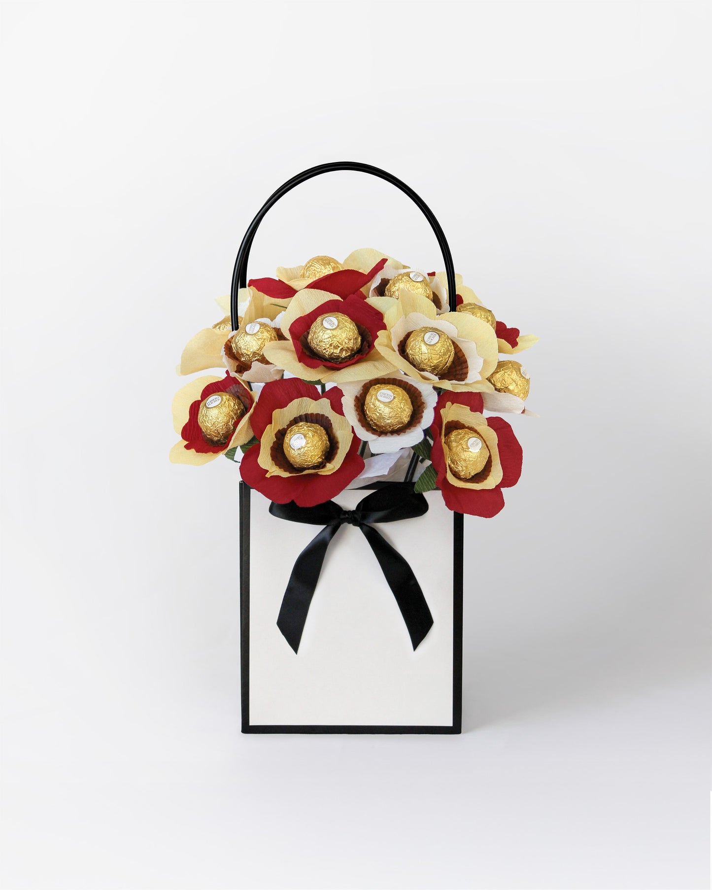 Small Strawberry Shortcake inspired bloom box with handmade deep red and cream chocolate centred flowers