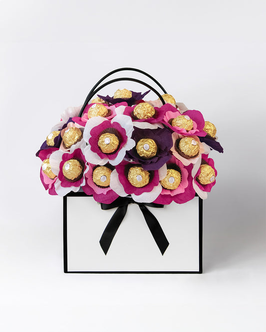 Blackberry Cheesecake bloom box with deep berry and cream coloured chocolate flowers