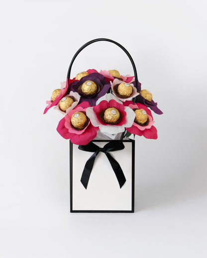 Elegant chocolate bloom box inspired by blackberry compote and cheesecake cream