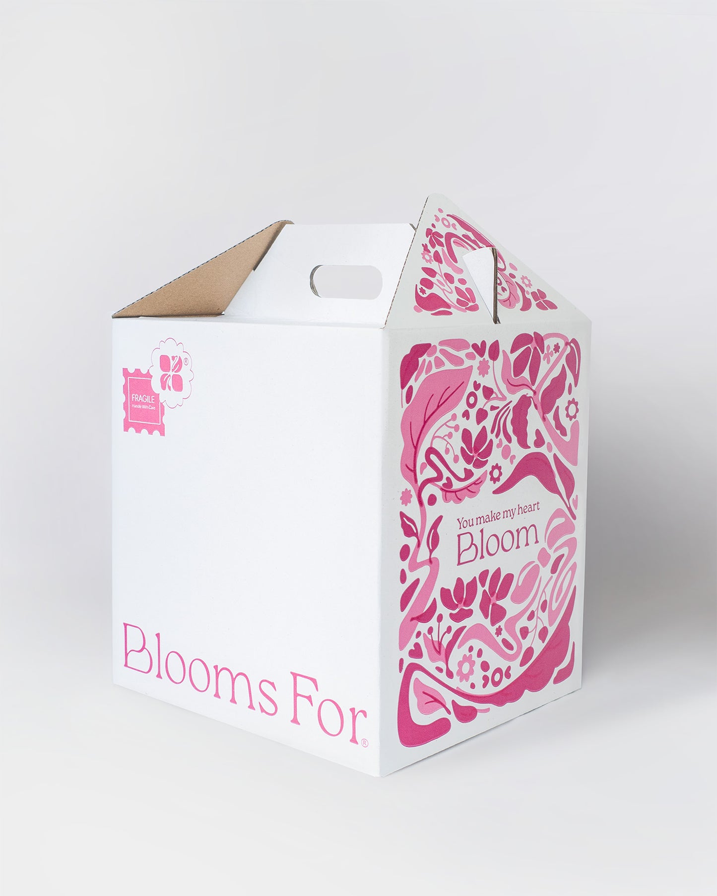 Custom designed Blooms For shipping box with elegant pink floral artwork and ‘You make my heart Bloom’ message – premium packaging for chocolate bloom boxes.